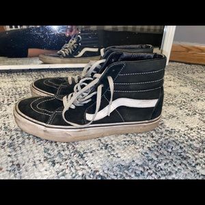 Black and white high top vans